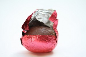 Chocolate easter egg in red wrapping