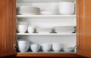 White Dishes and Bowls in Kitchen Cabinet