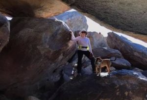 Michelle and her dog hiking