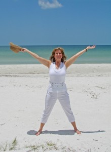 woman stretching on beach